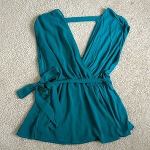 Bebe teal V neck peplum style top with open back